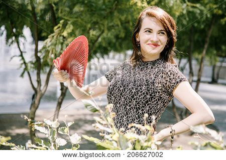 A Young Girl Walks In An Old Park.