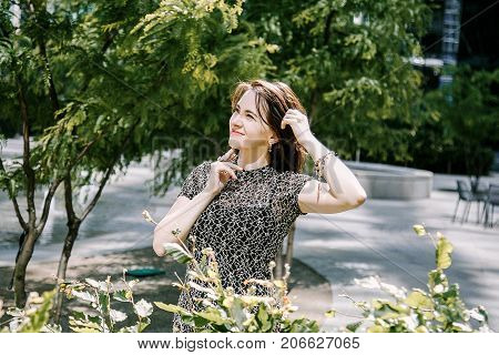 A Young Girl Walks In An Old Park.