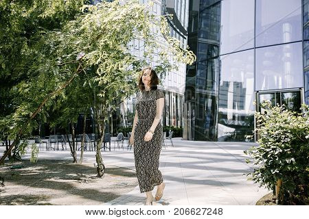 A Young Girl Walks In An Old Park.