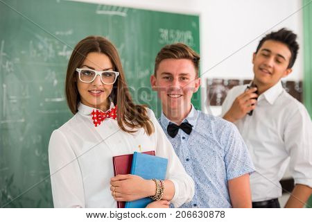 Girl with green baord behind