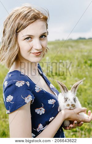 Young Girl With A Little Rabbit.