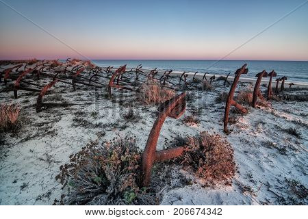 Sunset on the beach of Barril, cemetery of anchors. Tavira Algarve