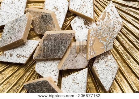 Stock photo of Kaju Katli, a popular indian sweet burfi made using milk, khoya, cachew and Sugar