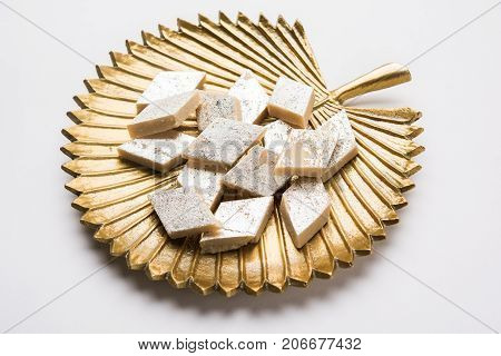 Stock photo of Kaju Katli, a popular indian sweet burfi made using milk, khoya, cachew and Sugar