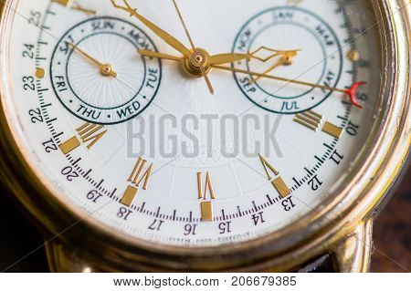 A Macro view of a gold watch.