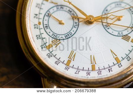 A Macro view of a gold watch.