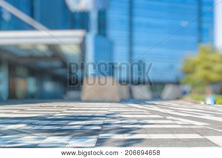 empty pavement and modern buildings in city