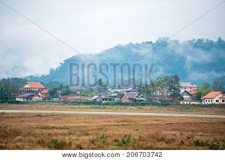 Foggy Landscape In Louangphabang, Laos. Copy Space For Text.