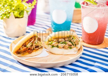 red barbecue pork and chicken soft buns with iced fruite soda drinks modern asian fusion style food
