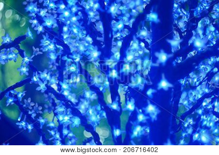 Christmas Led Lights In The Form Of Flowers, Blue Bokeh, Selected Focus
