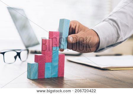 Businessman Building A Successful Financial Graph