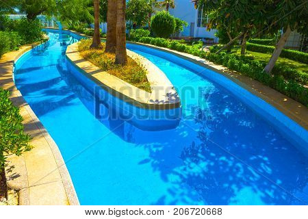 Sharm El Sheikh, Egypt - September 26, 2017: The pool lazy river at Hotel Monter Carlo Sharm Resort and SPA at Sharm El Sheikh, Egypt on September 26, 2017