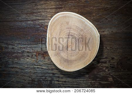 Wood plate on wood background top view
