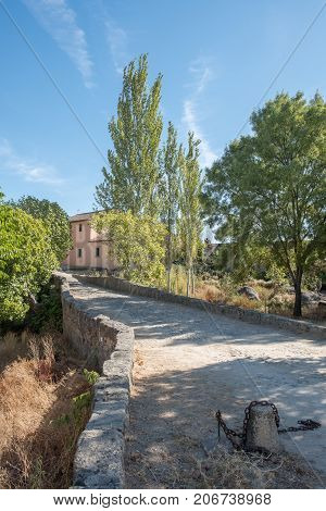 Bridge to access the House next to the marsh located in the area of Barruecos, Caceres, Spain