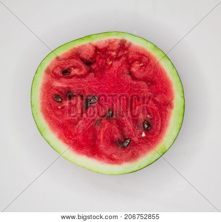Half of ripe watermelon on a white background