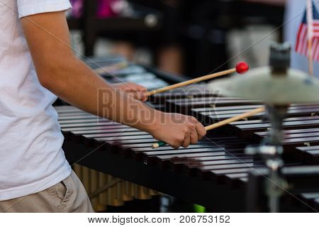 a percussionist playing a vibraphone during a rehearsal