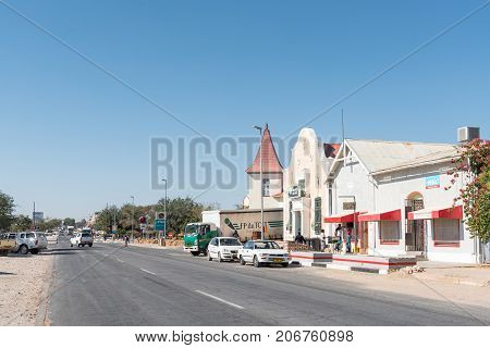 KARIBIB NAMIBIA - JULY 3 2017: A street scene with historic buildings businesses and vehicles in Karibib a small town in the Erongo Region of Namibia.