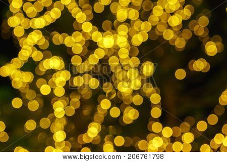 Defocused lights abstract golden nonagon bokeh background