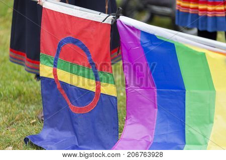 The Sami Flag and the Rainbow Flag side by side.
