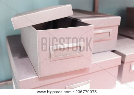 Stack of Empty Office Storage Boxes or Archive Boxes Used for Storing Paper Media and Accessories.