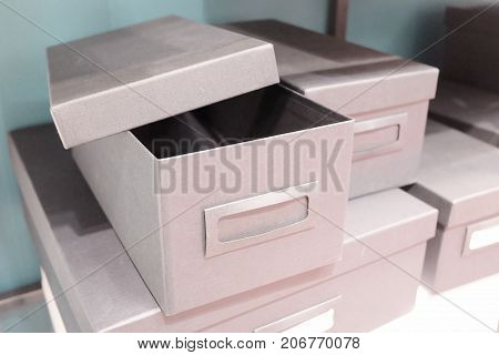 Stack of Empty Office Storage Boxes or Archive Boxes Used for Storing Paper Media and Accessories.