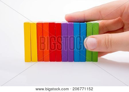 Hand Holding Color Dominoes