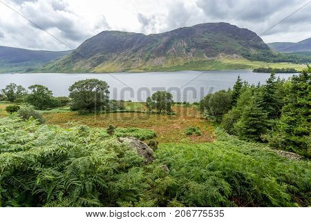 A landscape view of Crummock Water one of the lakes in the Lake District Cumbria United Kingdom.