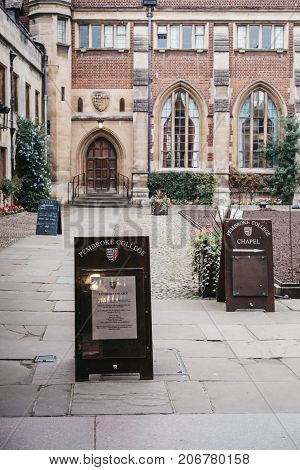 CAMBRIDGE, UK - SEPTEMBER 25, 2017: Signs in the courtyard of Pembroke College. The college is the third-oldest college of the Cambridge university and has over seven hundred students and fellows.