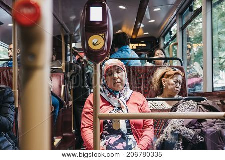 LONDON, UK - SEPTEMBER 24, 2017: Passengers inside a New Routemaster, a hybrid diesel-electric double-decker bus operated in London, UK.