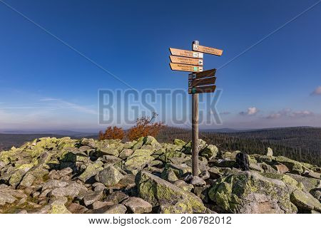 Luzny Sumava. Lusen Bavaria Germany. Tourist signpost at the top of Luzny Hill. Colorful autumn in mountain Sumava. Germany