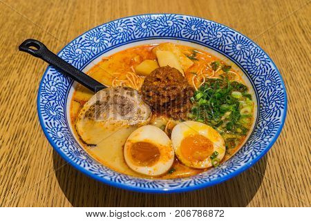Japanese Tamago Spicy Ramen With Cha Shu Pork On Wooden Background