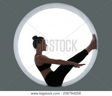 Young beautiful woman doing yoga pose on white background