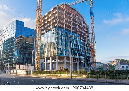 BRUSSELS, BELGIUM - JUNE 04, 2017: Unfinished building of the headquarters of  European Union at dawn