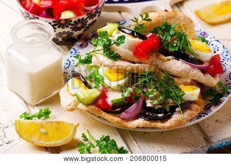 pita sabich sandwich with hummus and vegetables..selective focus