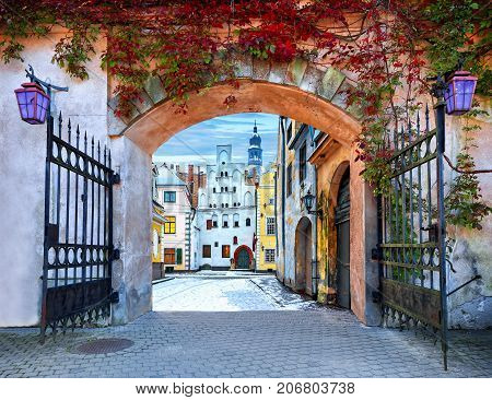 Gate to the winter tme in fairland of medieval town. Conceptual image symbolizing  season year changes
