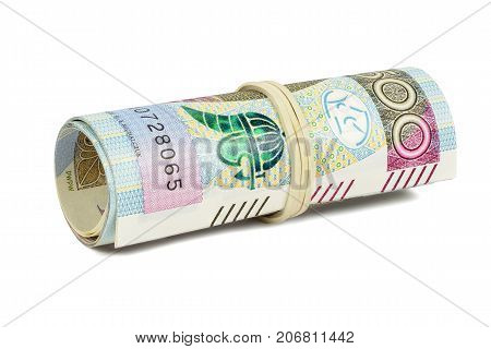 Polish banknotes of 500 PLN rolled with rubber isolated on white background with clipping path