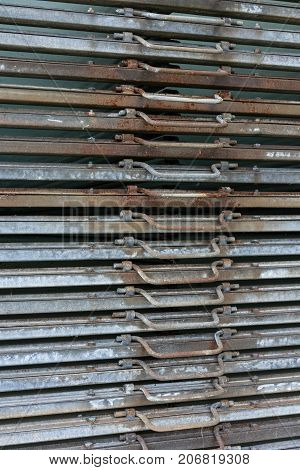 rusty iron metal plates front view with handle for industrial use and gardening