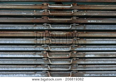 rusty iron metal plates front view with handle for industrial use and gardening
