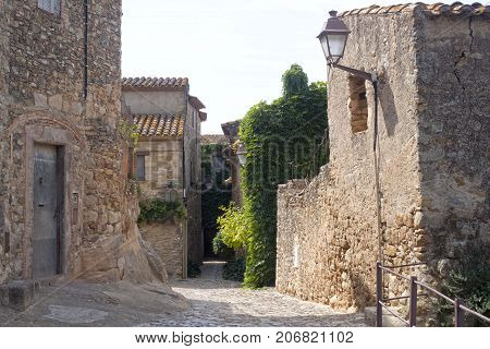Narrow Street, Stone Pavement In Peratallada, Spain