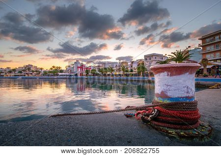 The pictursque port of Sitia, Crete, Greece at sunset. Sitia is a traditional town at the east Crete near the beach of palm trees, Vai.