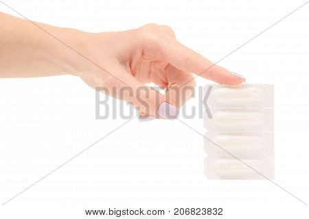 Female hand holding suppositoria medicine on white background isolation