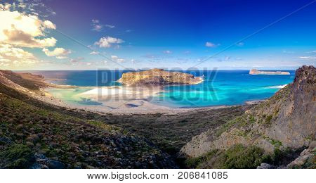 Amazing view of Balos Lagoon with magical turquoise waters, lagoons, tropical beaches of pure white sand and Gramvousa island on Crete, Greece