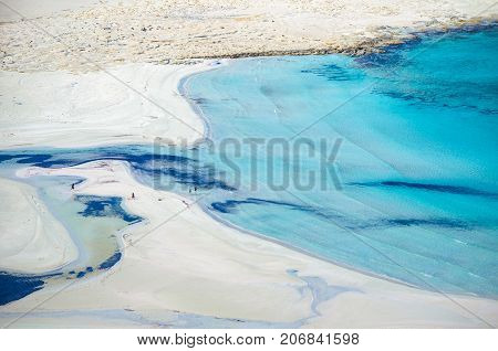 Amazing view of Balos Lagoon with magical turquoise waters, lagoons, tropical beaches of pure white sand and Gramvousa island on Crete, Greece