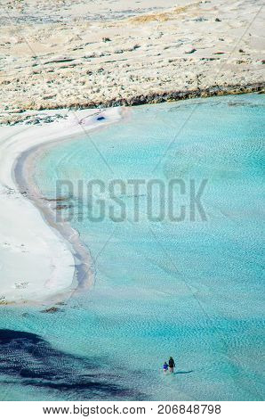 Amazing view of Balos Lagoon with magical turquoise waters, lagoons, tropical beaches of pure white sand and Gramvousa island on Crete, Greece