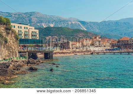 Budva, Montenegro - August 18, 2017: View of the modern beach town of Budva, Montenegro. Budva is one of the best and most popular resorts of the Adriatic Riviera. Beautiful beach at Budva's riviera.