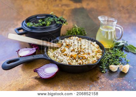 Risotto with chanterelle mushrooms and herbs. Italian food.