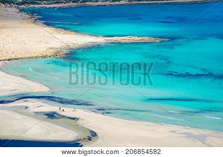 Amazing view of Balos Lagoon with magical turquoise waters, lagoons, tropical beaches of pure white sand and Gramvousa island on Crete, Greece