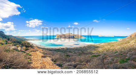 Amazing view of Balos Lagoon with magical turquoise waters, lagoons, tropical beaches of pure white sand and Gramvousa island on Crete, Greece