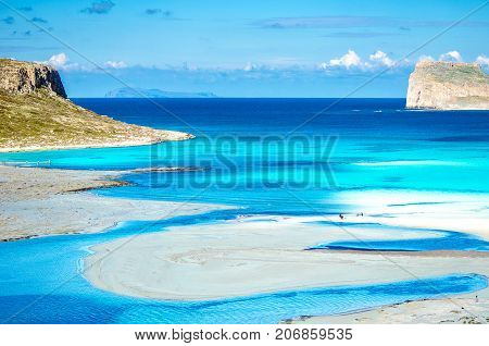 Amazing view of Balos Lagoon with magical turquoise waters, lagoons, tropical beaches of pure white sand and Gramvousa island on Crete, Greece