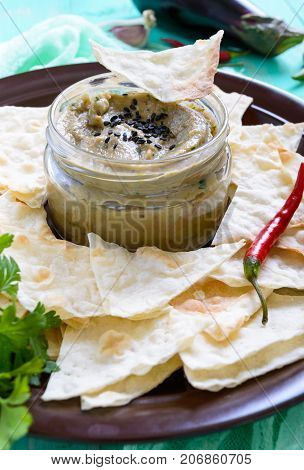 Light dietary pate from eggplant. Baba ganush is an Asian dish. Serve with thin lavash on a ceramic bowl.